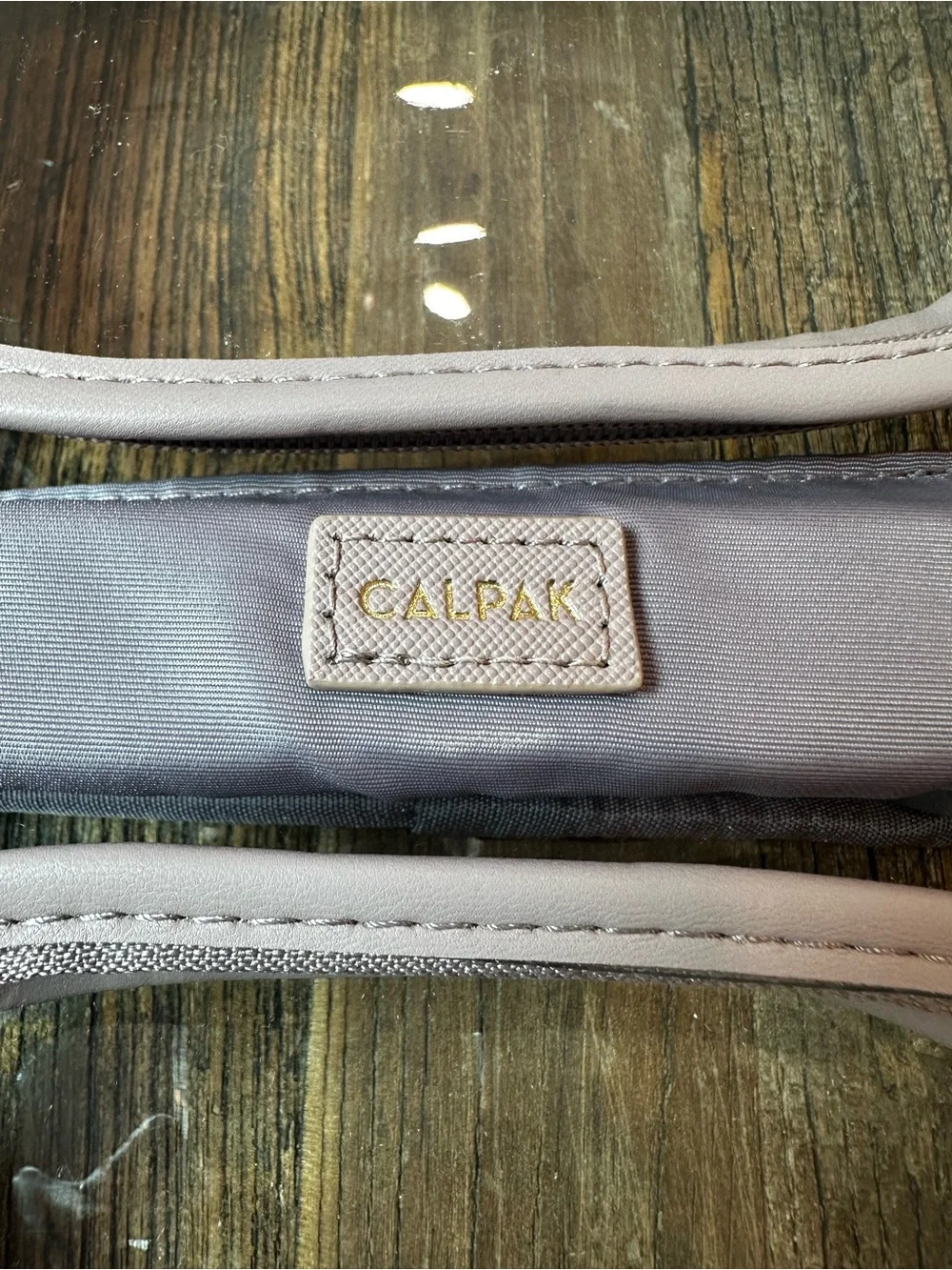 Calpak Clear Cosmetic Case with Dusty Mauve Trim